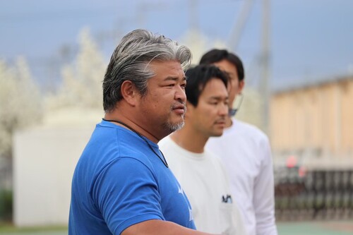 流通経済大学陸上部土井監督の写真